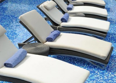 chaise lounges in a pool